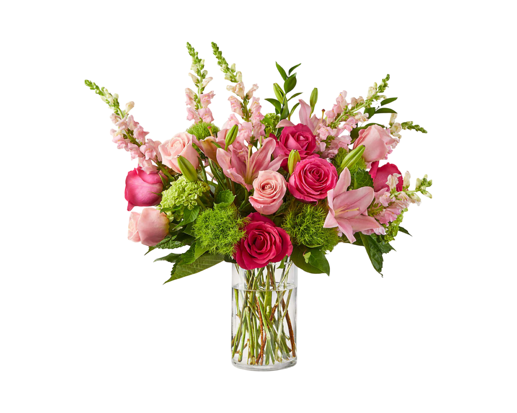 A bright and cheerful floral arrangement presented in a clear cylindrical glass vase, featuring a mix of hot pink and blush roses, pink lilies, pink snapdragons, green hydrangea, and green moss ball dianthus. The lively blend of pink tones and lush greens creates a fresh and uplifting design—perfect for romantic gestures, celebrations, or cheerful surprises.