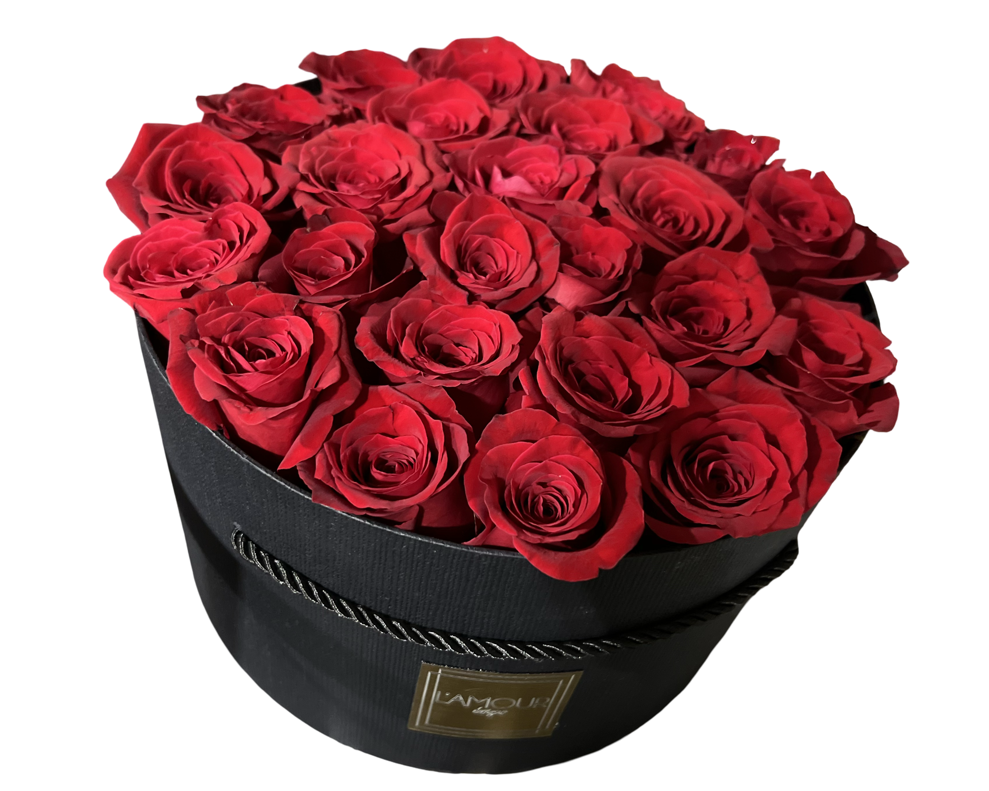 A luxurious and classic floral presentation featuring deep red roses meticulously arranged in a sleek round black hatbox from L’amour Designs. The tight dome of velvety roses is rich in color and romance, making it a bold and unforgettable gift—perfect for grand gestures of love and admiration.