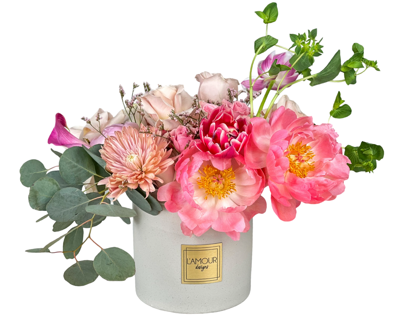 Pink and peach flowers in white vase.