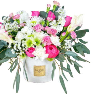 Pink and white floral arrangement in vase.